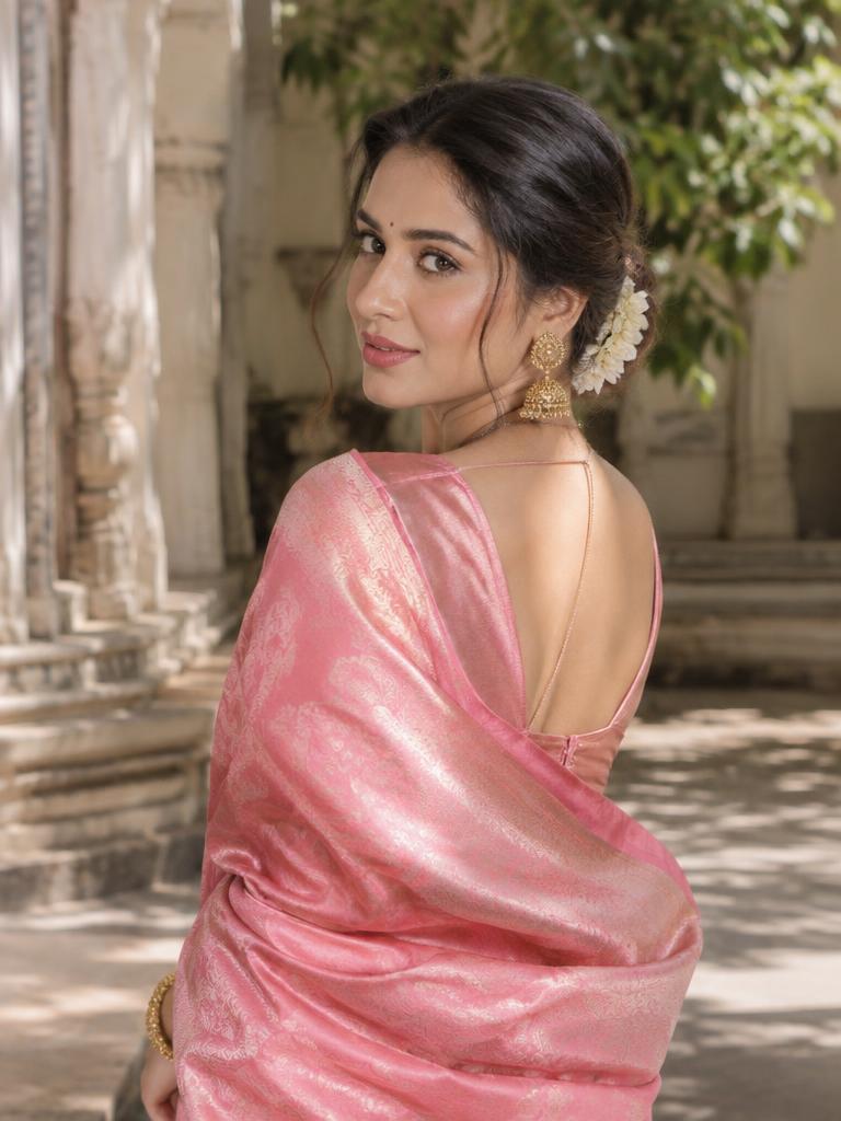 Bride in rose silk looking over her shoulder